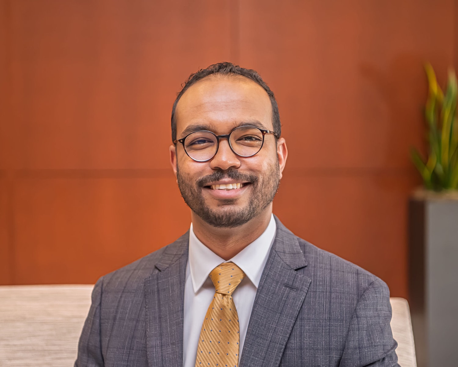 Smiling professional man in business attire.