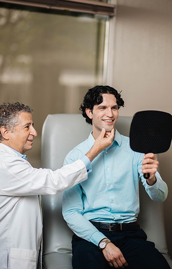 Doctor examining patient in medical setting.