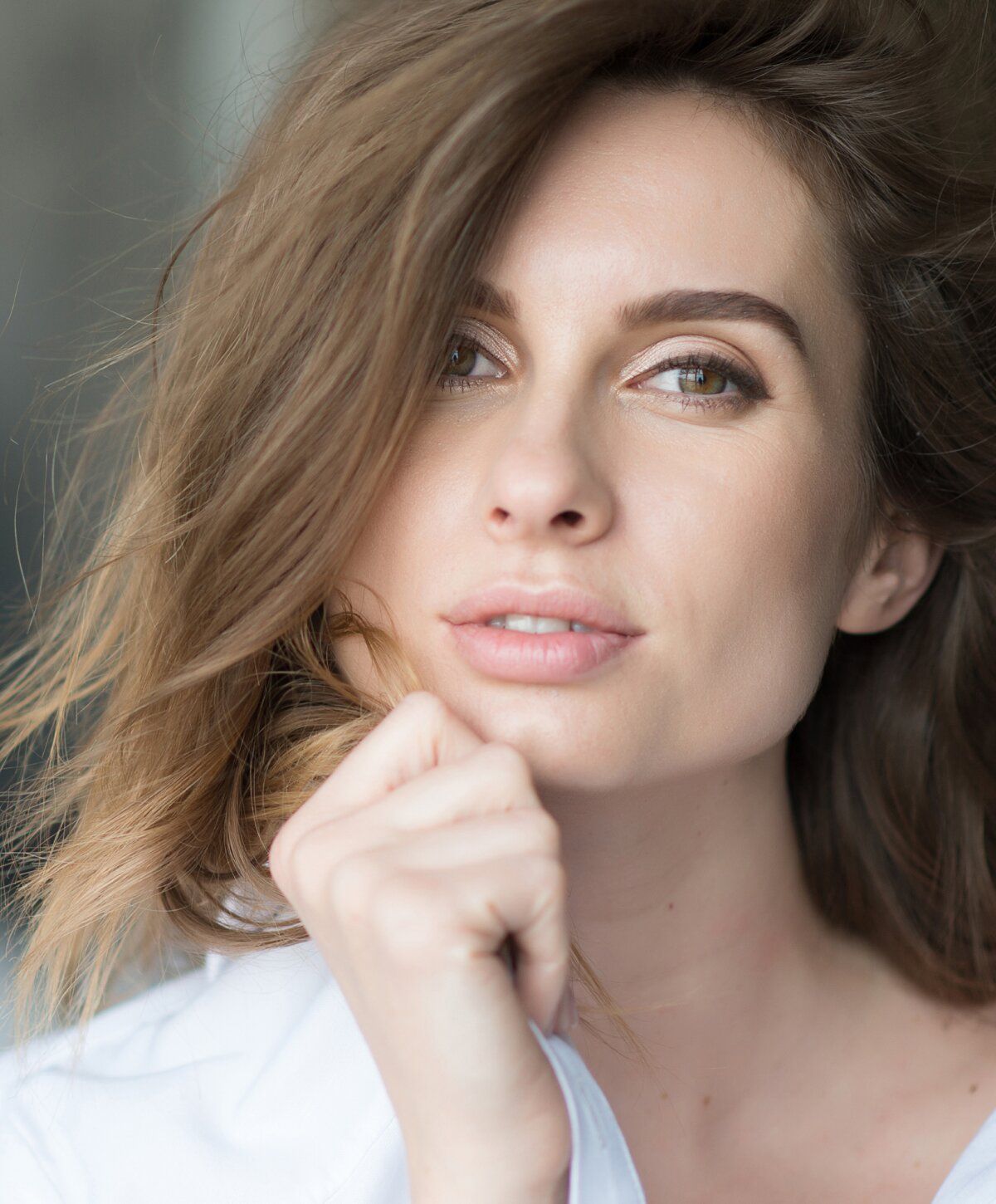 Memphis Moxi Laser Treatments model with thoughtful expression.