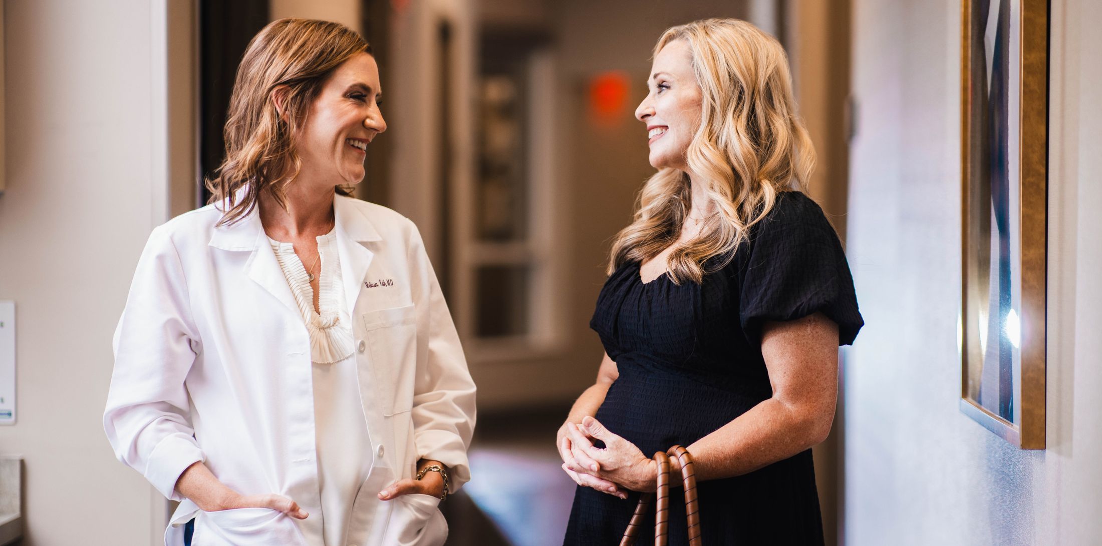 plastic surgery group of memphis staff talking in the hall